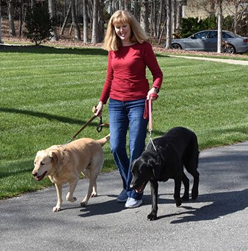 Sandy Altman walking her dogs