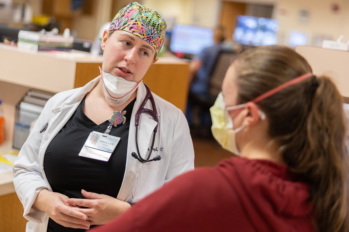 Emergency Department provider talks with female