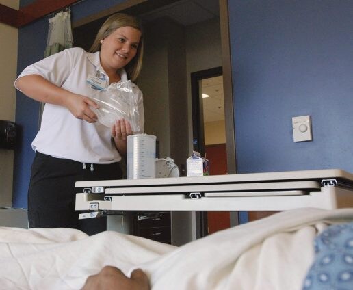 Junior volunteer eleanor hinnant helping patient