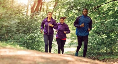 three runners on a trail 