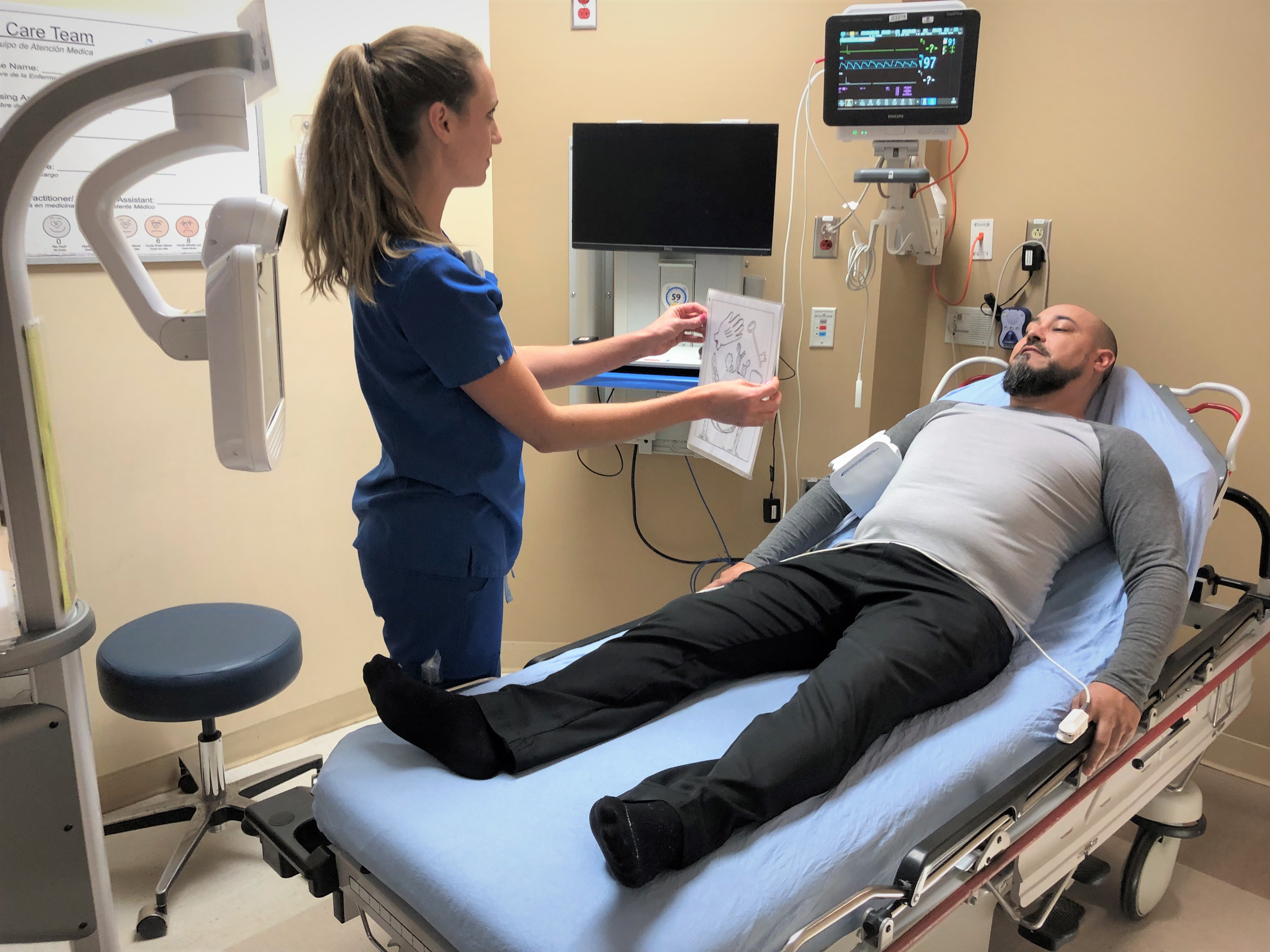 nurse checking patient for stroke symptoms